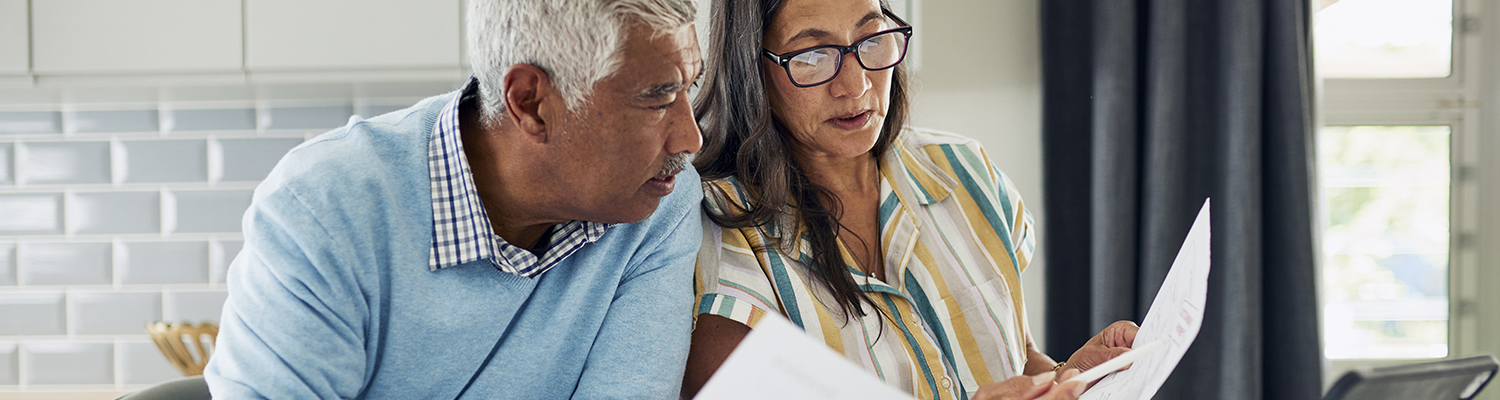 couple looking at invoices couple looking at invoices